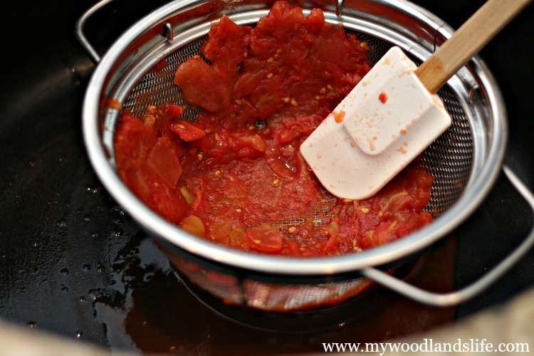 Use a strainer or colander to strain and press out liquid from diced tomatoes when making soup and salsa