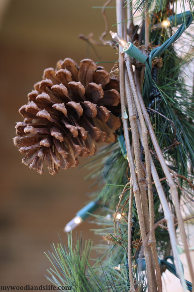 Budget-friendly outdoor Christmas decorations pinecones and grapevines enhance Walmart pine garland