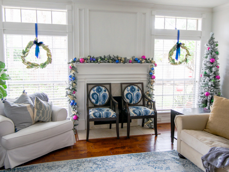 Formal living room Christmas decorations DIY grapevine magnolia wreaths and spruced up Walmart garland and tree