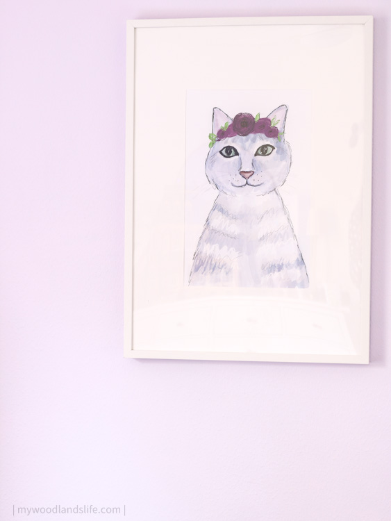 Cat-themed wall art with a flower crown that I painted for a purple themed nursery or little girl bedroom