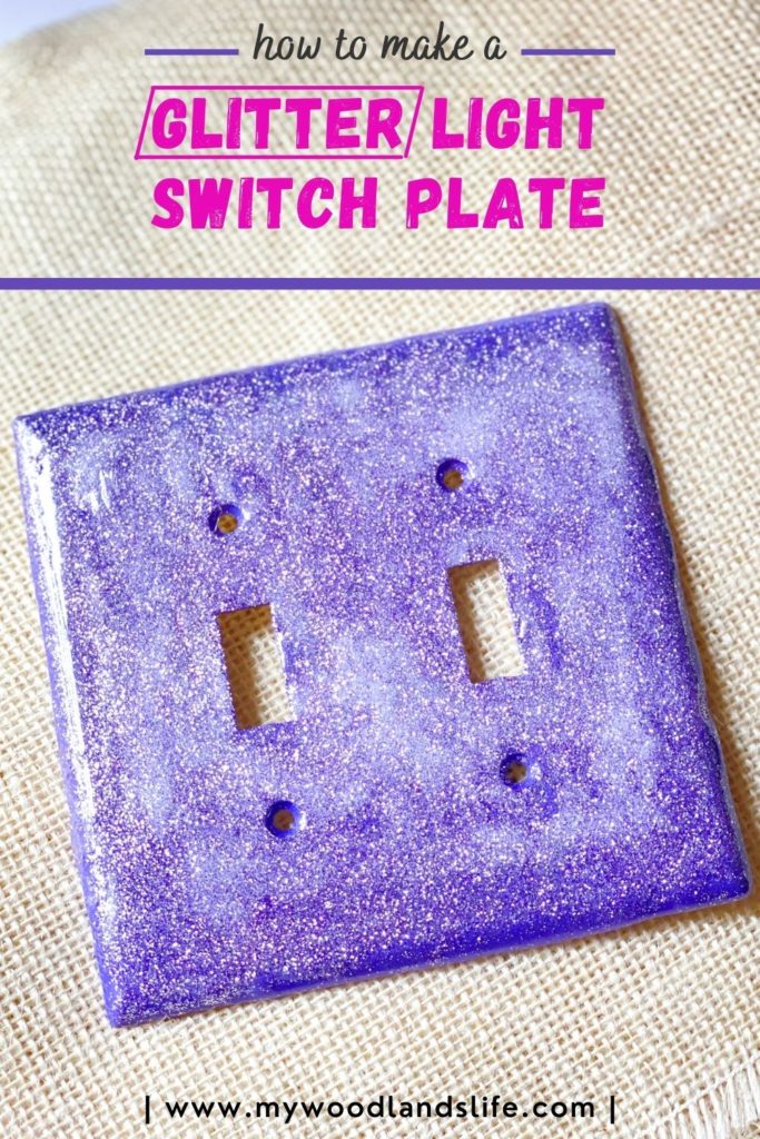 Light switch cover plate painted with glitter and purple on burlap background