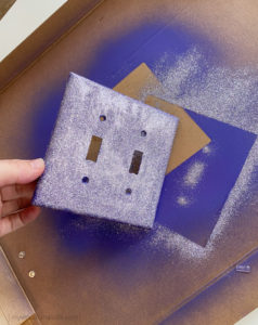 Tapping off glitter from switch plate cover