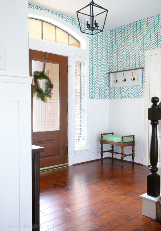Entryway with peel and stick green chevron wallpaper and board and batten