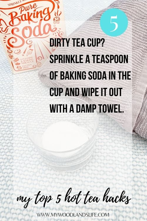 Box of baking soda, glass container with loose baking soda, and dish towel