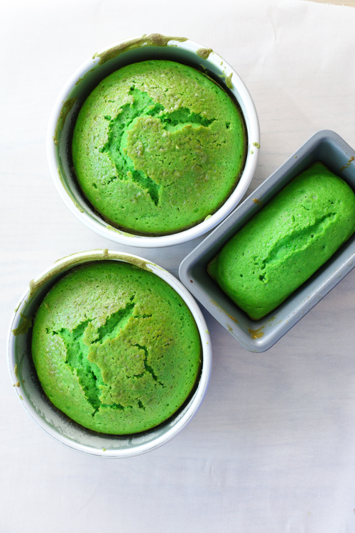 Two six-inch round cake pans and one mini loaf pan filled with green cake